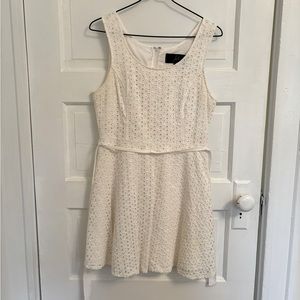 White boutique dress with petal cutouts. Size small-medium